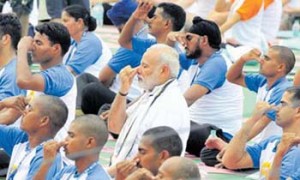 Prime Minister Narendra Modi doing Yoga during the 2nd international Day of Yoga, organised at capitol complex in Chandigarh on Tuesday - Tribune Photo-S.Chandan