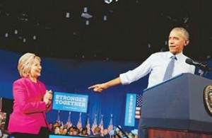 U.S. President Obama points to Democratic U.S. presidential candidate Clinton at campaign event in Charlotte, North Carolina